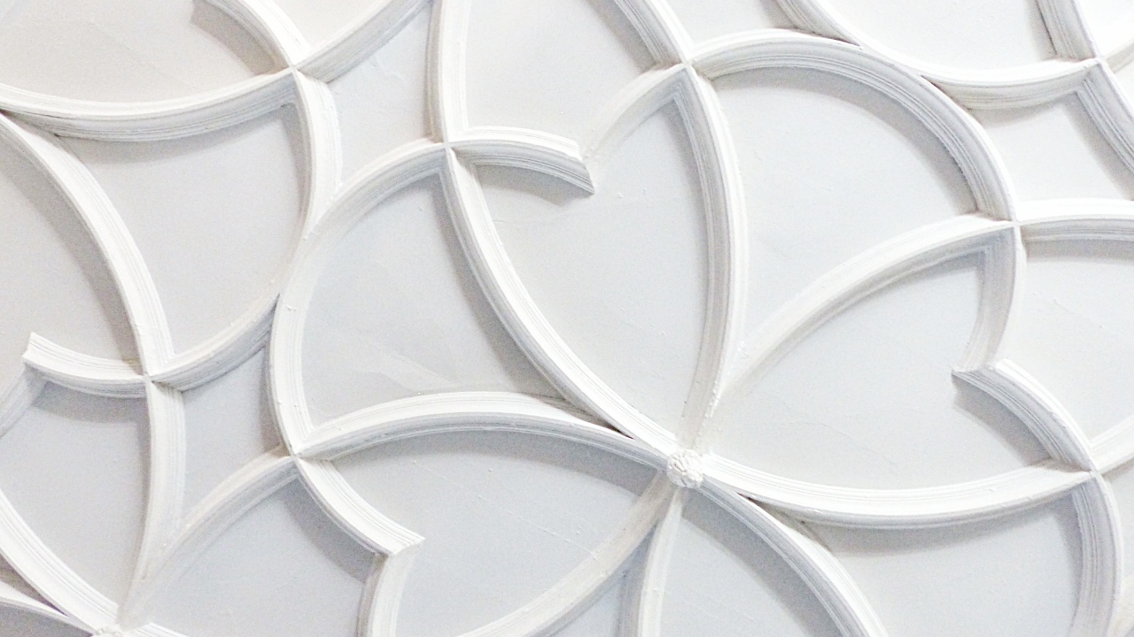 Pattern of swirls in white ceiling