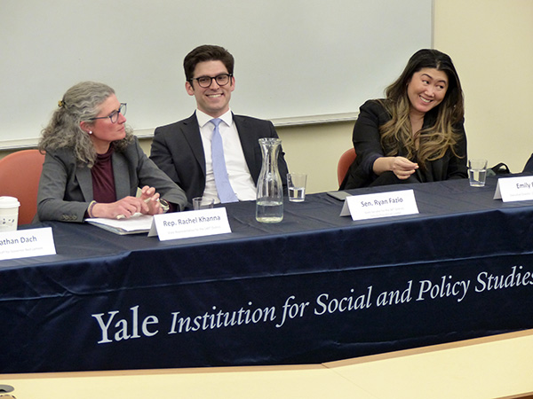 Rachel Khanna, Ryan Fazio, and Emily Byrne seated on a panel
