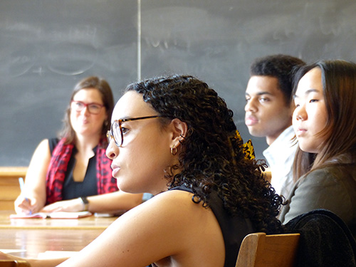 Emily Cain listens to a student speak