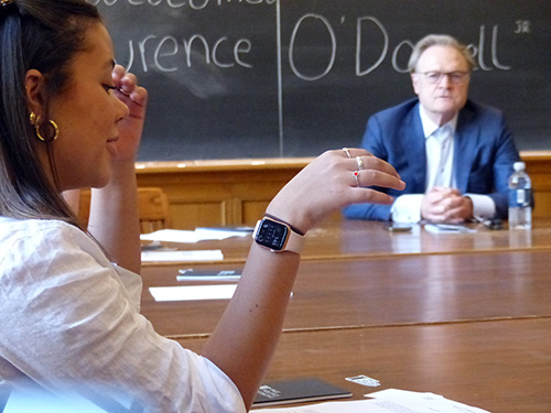 Lawrence O'Donnell listens to a student speak