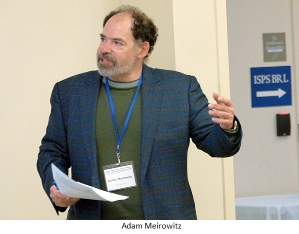 Adam Meirowitz speaks in a conference room