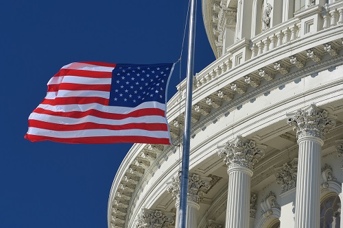 Flag flies outside the U.S. Capitol building