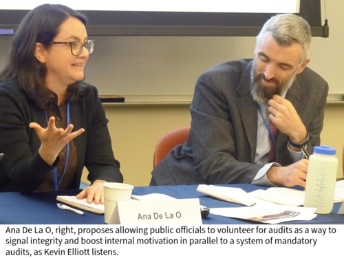 Ana De La O Speaks at a conference table next to Kevin Elliott