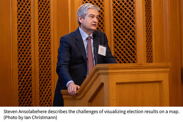  Steven Ansolabehere describes the challenges of visualizing election results on a map. (Photo by Ian Christmann)