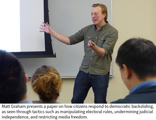 Matt Graham speaks in a classroom, as seen from the audience.