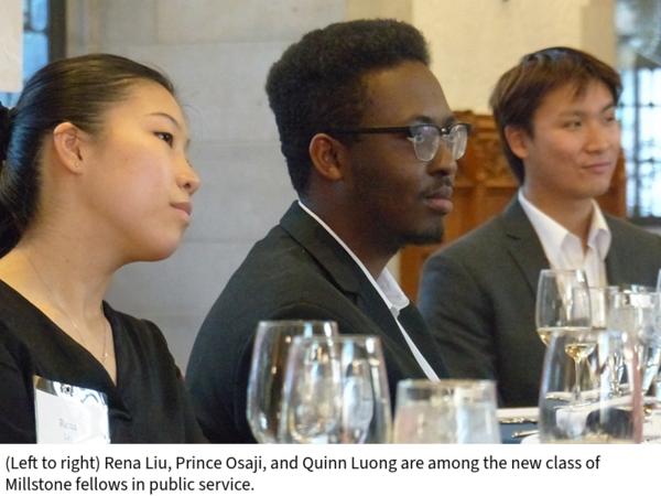 Rena Liu, Prince Osaji, and Quinn Luong listen to a speaker while seated at a dinner table covered in glasses