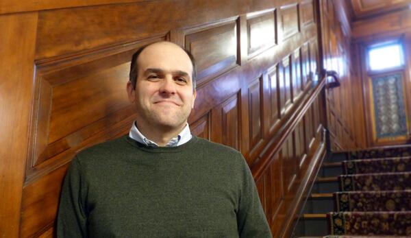 Eduardo Davila at the foot of a staircase