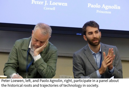 Peter Loewen and Paolo Agnolin participate in a panel at a table in a classroom