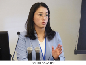 Seulki Lee-Geiller speaks at a lectern in a classroom