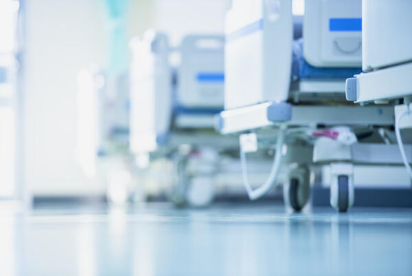 Blurred hospital corridor with hospital beds