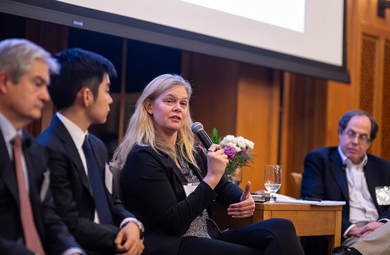  (left to right) Stephen Ansolabehere, Shiro Kuriwaki, Beverly Gage, and Alan Gerber discuss last month's elections in a wood-paneled conference room.