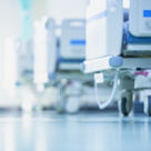 Blurred hospital corridor with hospital beds