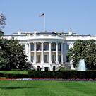 The White House south facade, surrounded by grass and trees